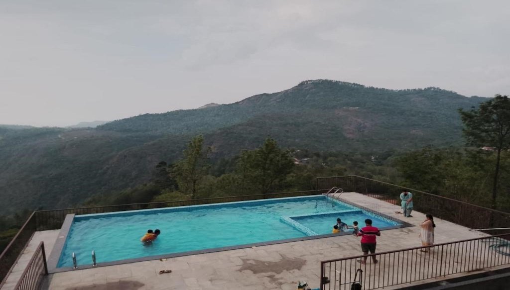 swimming pool hotel yercaud HillTop in green meadows