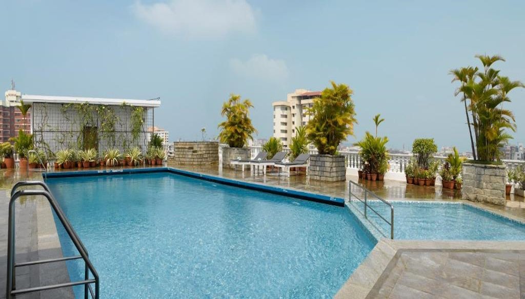 Abad Atrium swimming pool kochi hotel